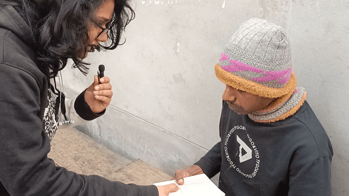Volunteer greeting a neighbor with a warm plate